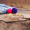 Jeweled Golden Bangle - with Faceted glass oval colorful jewels: Hot Pink