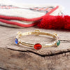 Jeweled Golden Bangle - with Faceted glass oval colorful jewels: Red